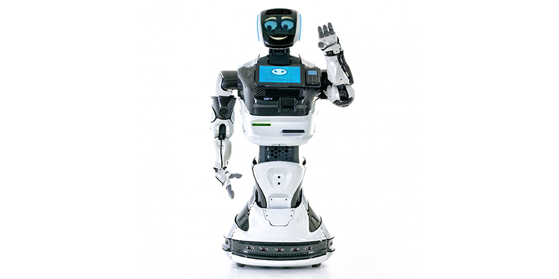 The humanoid robot, promobot, smiling and waving.