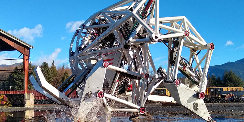 The exosapien exoskeleton walking across a lake with ease.